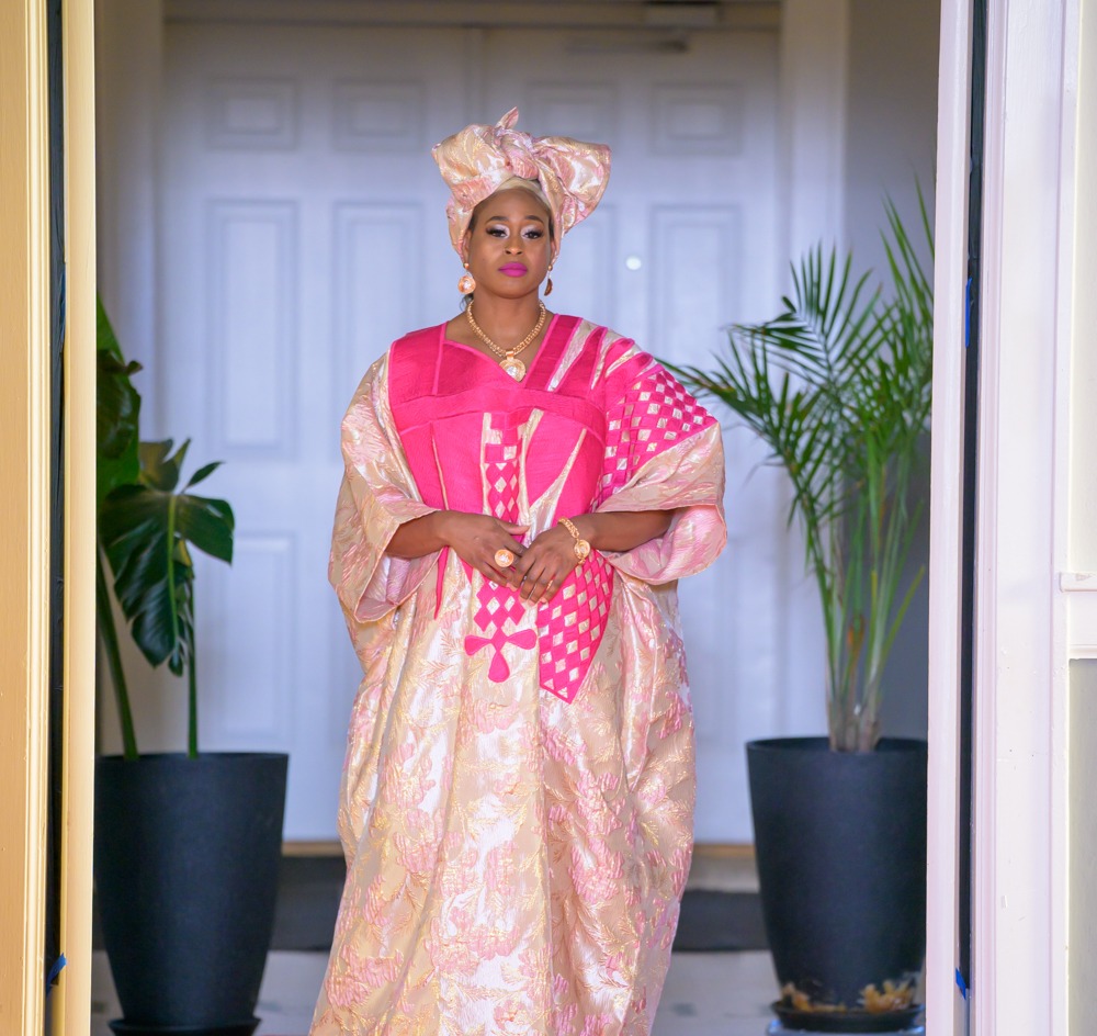 Adeyemi RoyaLabel womenswear look in ivory and pale gold with bright pink structured detailing and coordinating gele